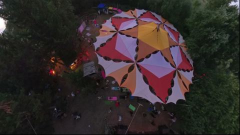 Aerial Flight Over the Mandala Canopy at Dusk