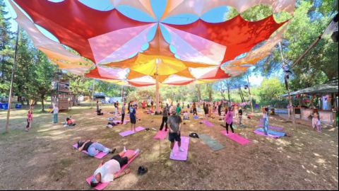 Morning Yoga Practice Under Colorful Sails